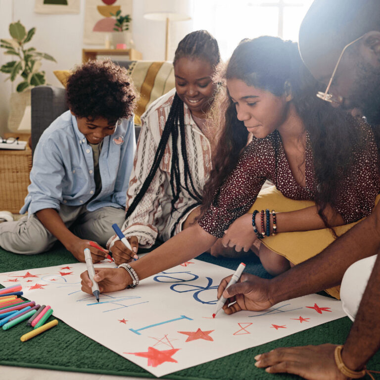 a black family doing a Black History Month craft to decorate a door