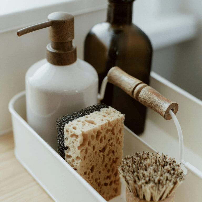 cleaning supplies in a basket for under the sink