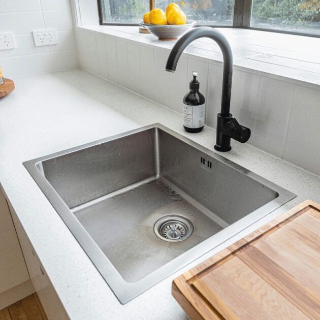 a freshly cleaned kitchen drain and sink