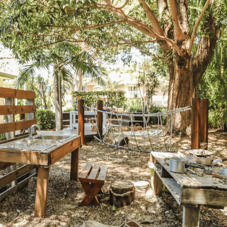 mud kitchen and bridge made from ropes and wood