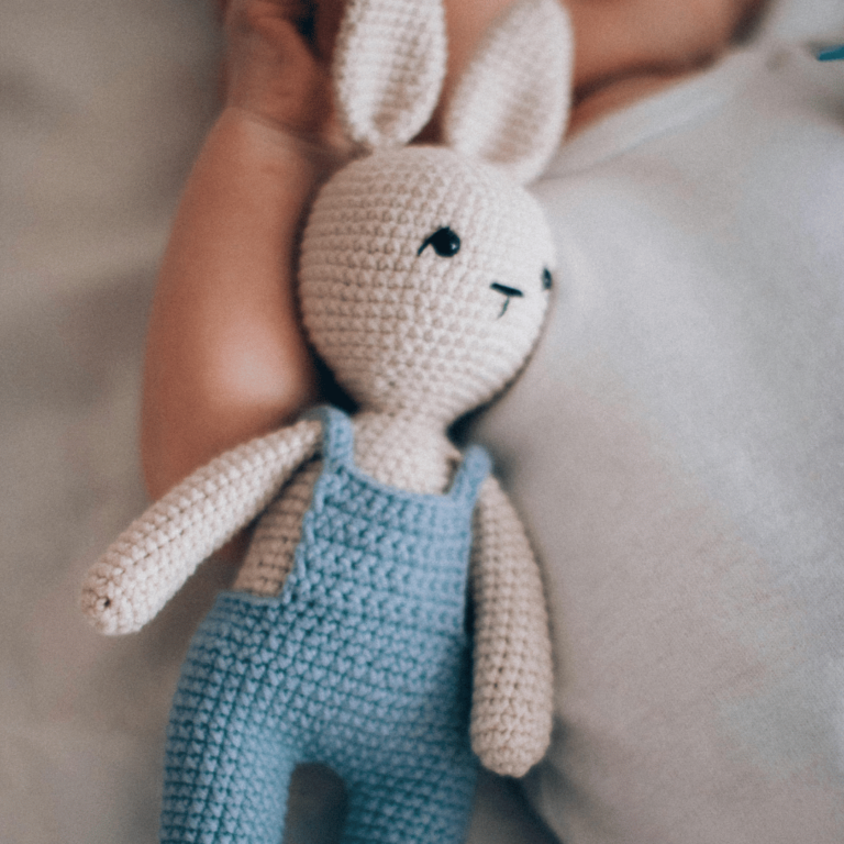 baby with Easter bunny stuffed animal