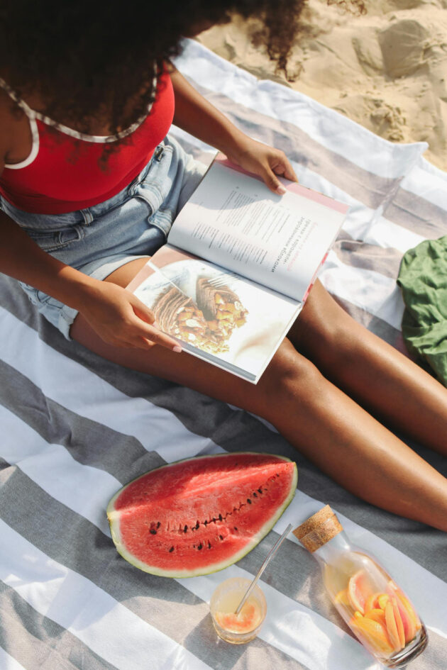 woman with an afro at the beach