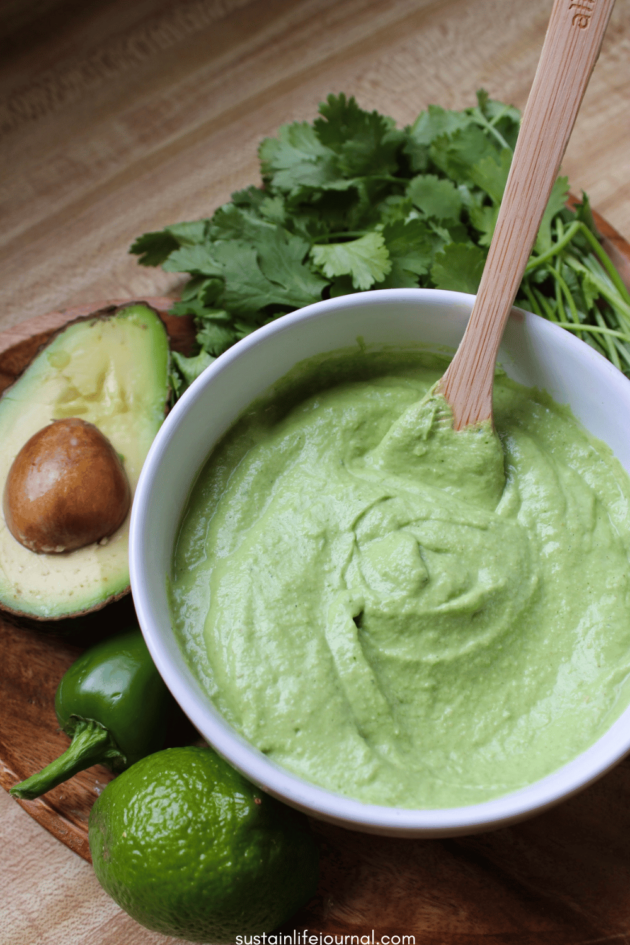a bowl of cilantro lime crema dressing
