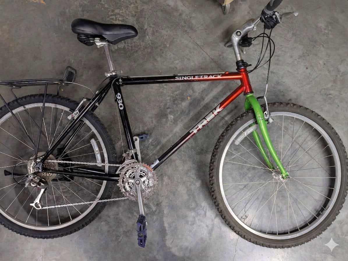 The distinctive Bikes for Neighbors shelter bike with a green fork.