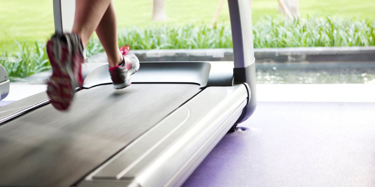 woman running on treadmill