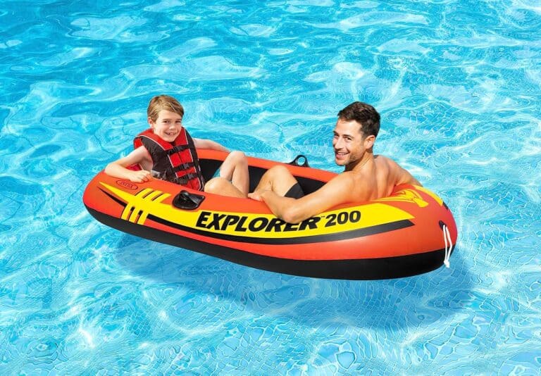 Two people in a pool float.