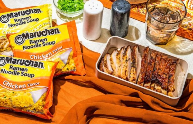 Maruchan ramen and chicken on decorative table.