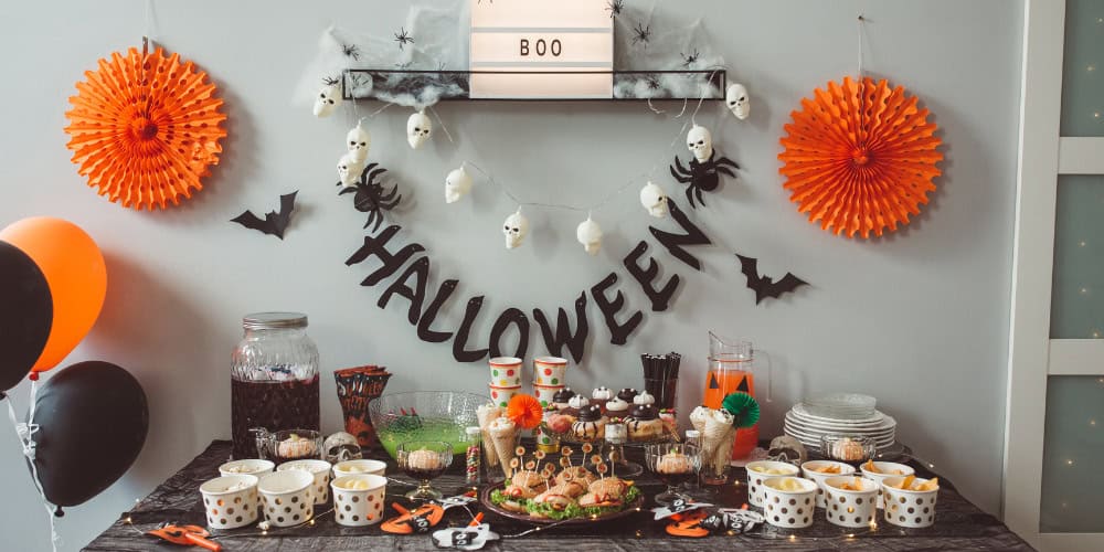 halloween party table with banner