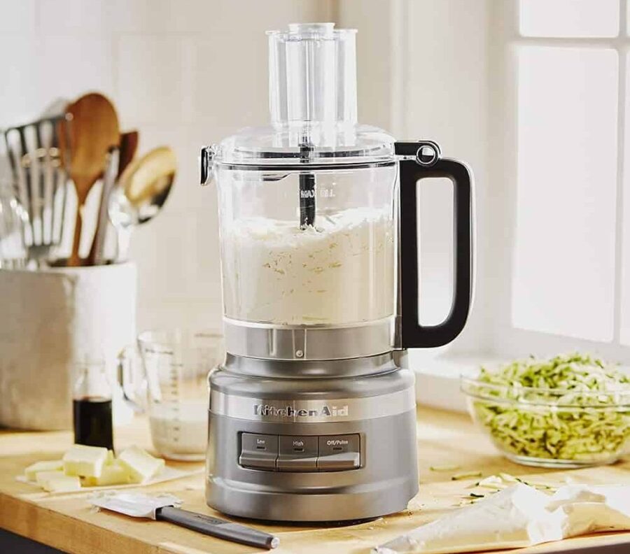 KitchenAid food processor on wooden kitchen counter