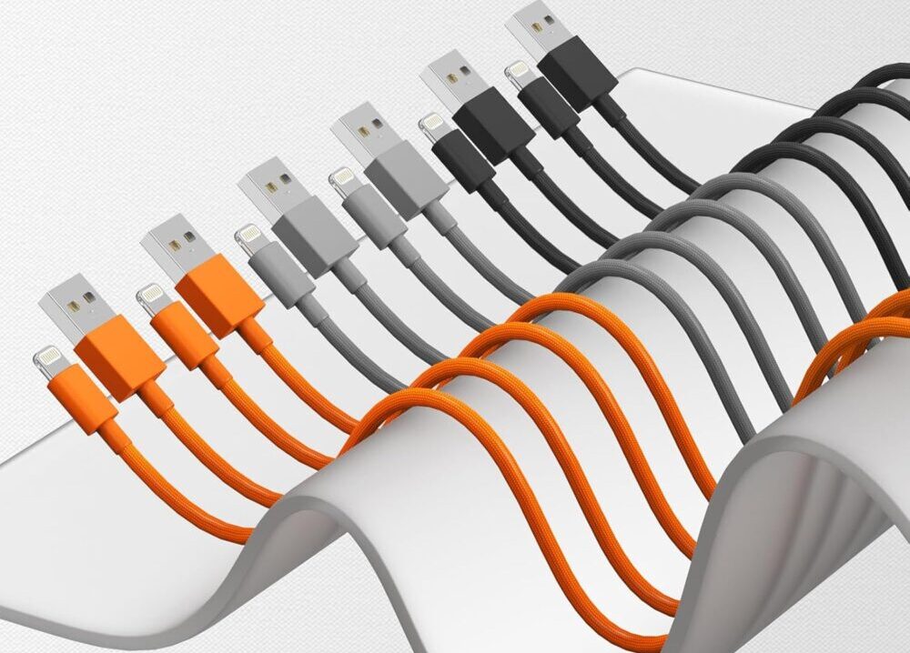 Colorful USB cables neatly arranged on white surface.