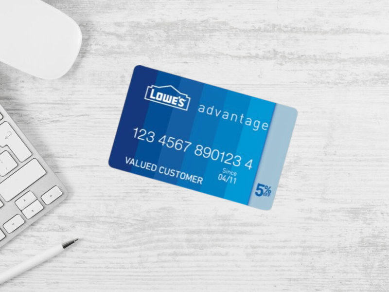 Lowe's credit card on white desk background.