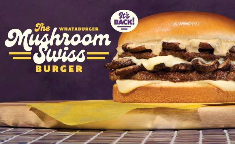 Whataburger Mushroom Swiss Burger returns on wooden board.