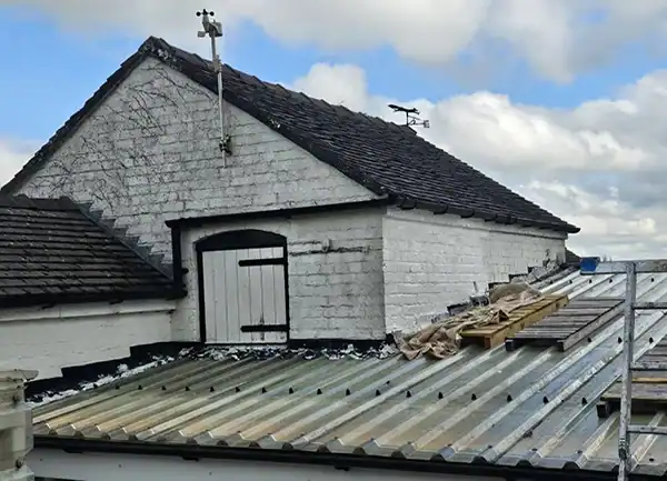 Newly painted house exterior with roofing renovation by SWS Painters & Decorators.