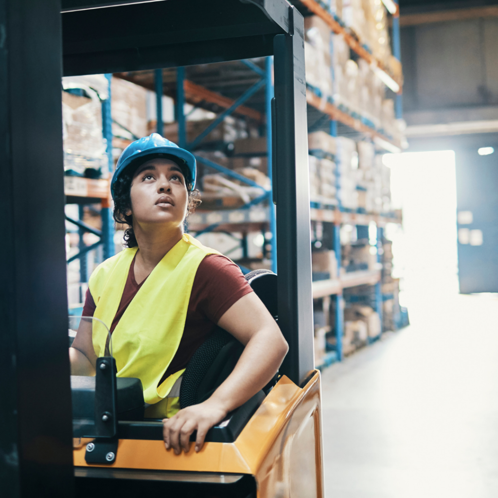 female forklift operator looking at load