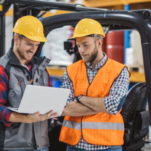 forklift driver and safety inspector beside forklift