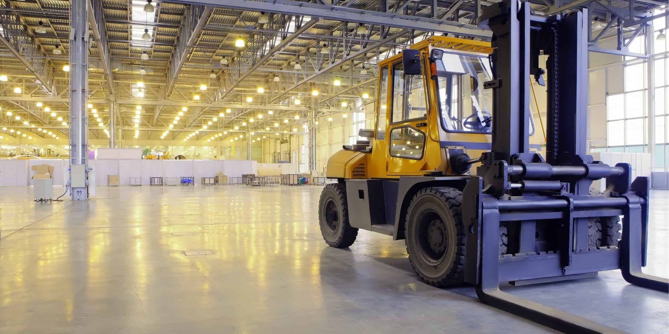 yellow forklift in empty warehouse showing halo rule space