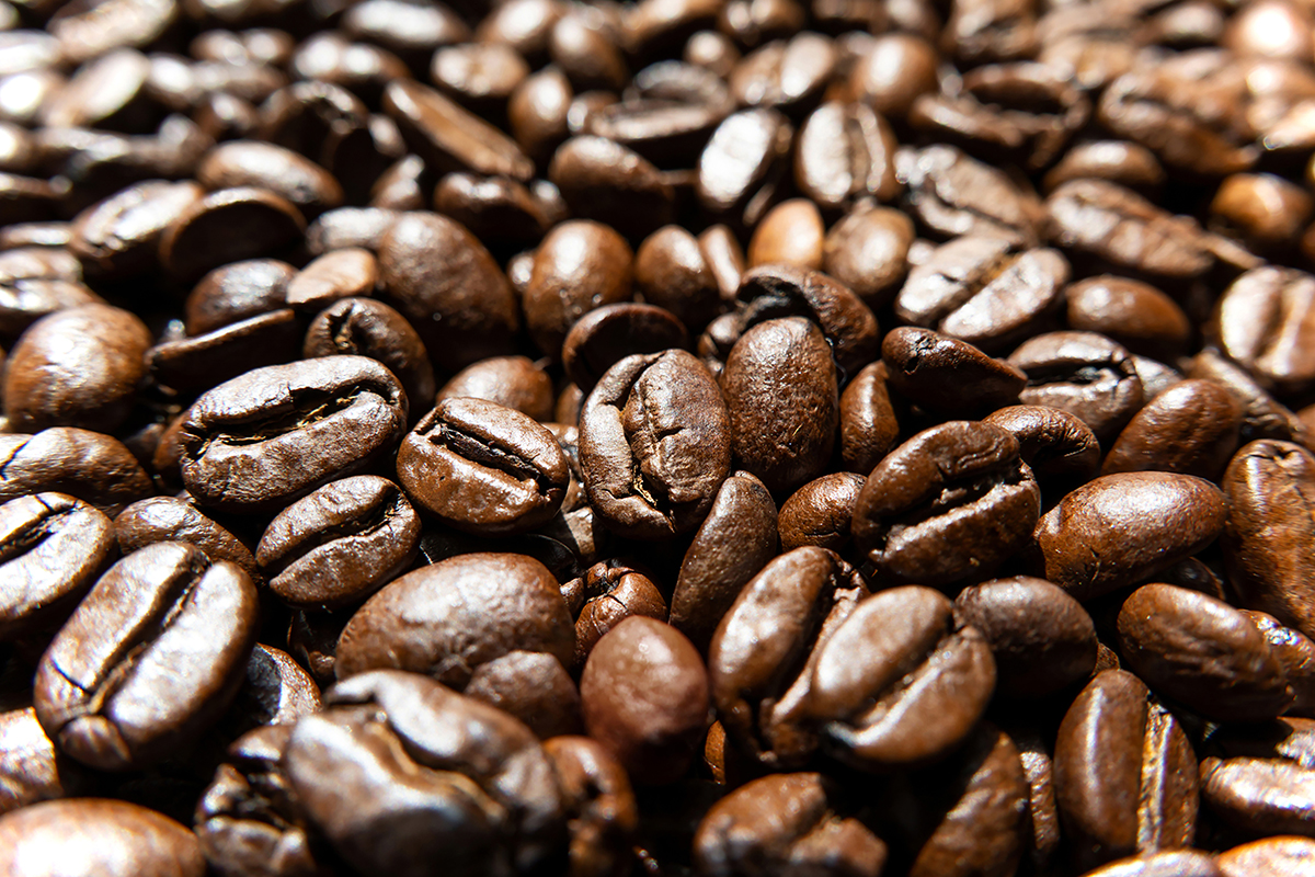 A close-up image of roasted coffee beans showing rich texture and natural highlights&mdash;an example of how to photograph close-up images with detail and contrast. &copy;Philip Ruopp
