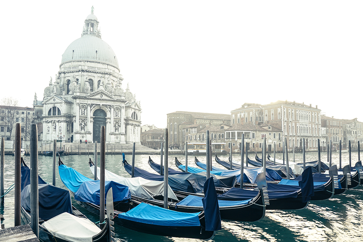 Gondolas in front of the historic Basilica di Santa Maria della Salute in Venice&mdash;showcasing classical architecture in travel photography.