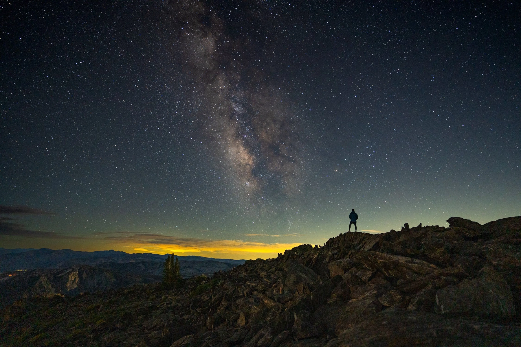 Night shot of the Milky Way with a full moon rising