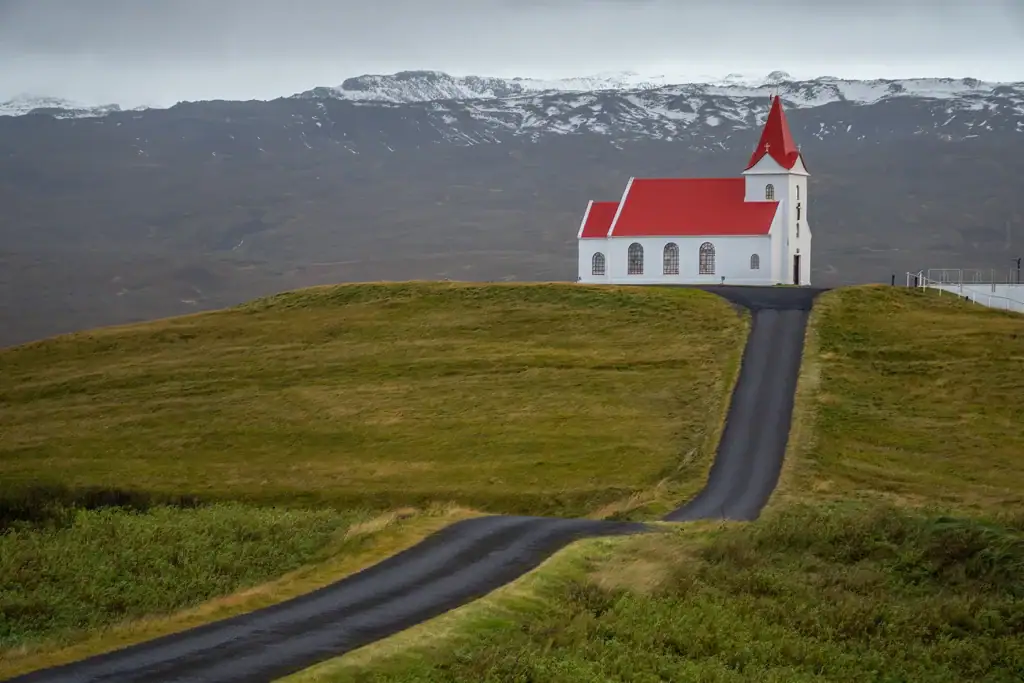 A church standing in isolation in the Icelandic countryside