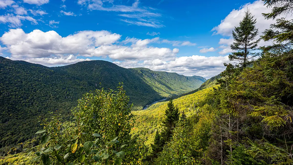 Mountain valley view photographed during a hike with the Tamron 16-30mm F/2.8 Di III VXD G2 wide angle lens, a best wide-angle zoom lens for landscape photography and travel adventures.