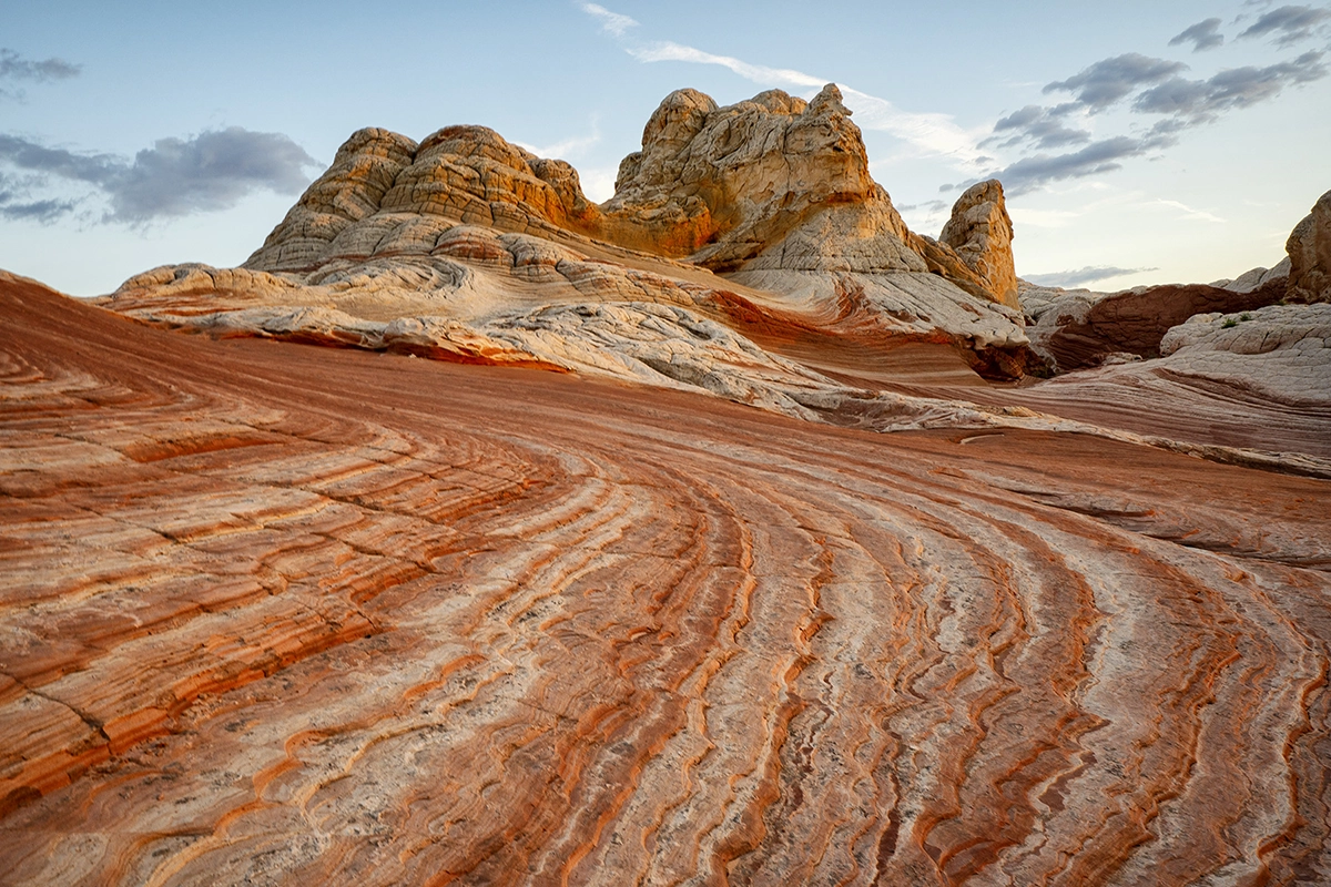 Wide-angle landscape of red rock formations captured with an APS-C camera, showing depth and detail across the scene.