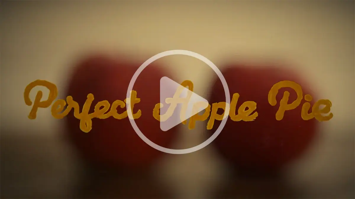 Thumbnail for &ldquo;Perfect Apple Pie&rdquo; short film video with handwritten title text over warm bokeh background.