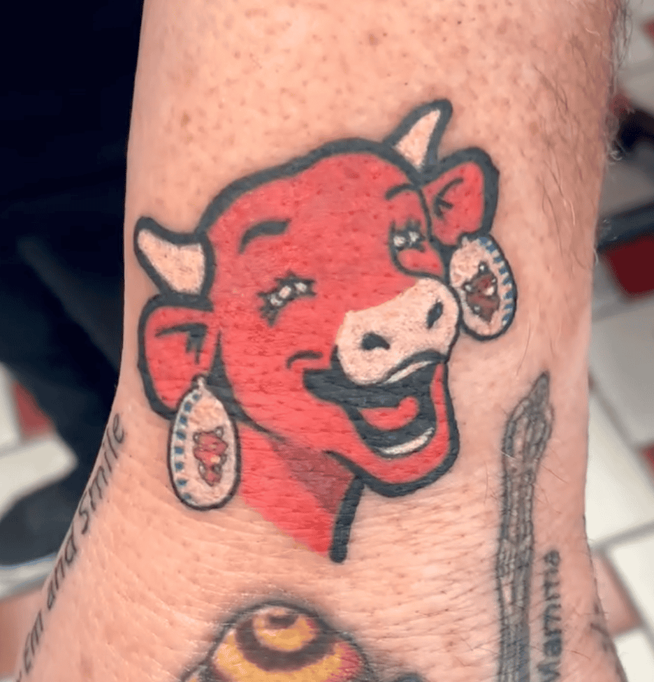 The Laughing Cow Bovine Tattoo