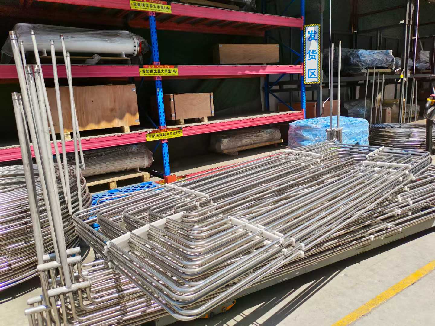 U-bent stainless steel heat exchanger tube bundles staged in the TeCarve shipping area