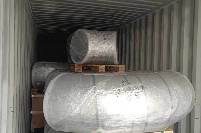 bundled steel pipes stacked for shipment