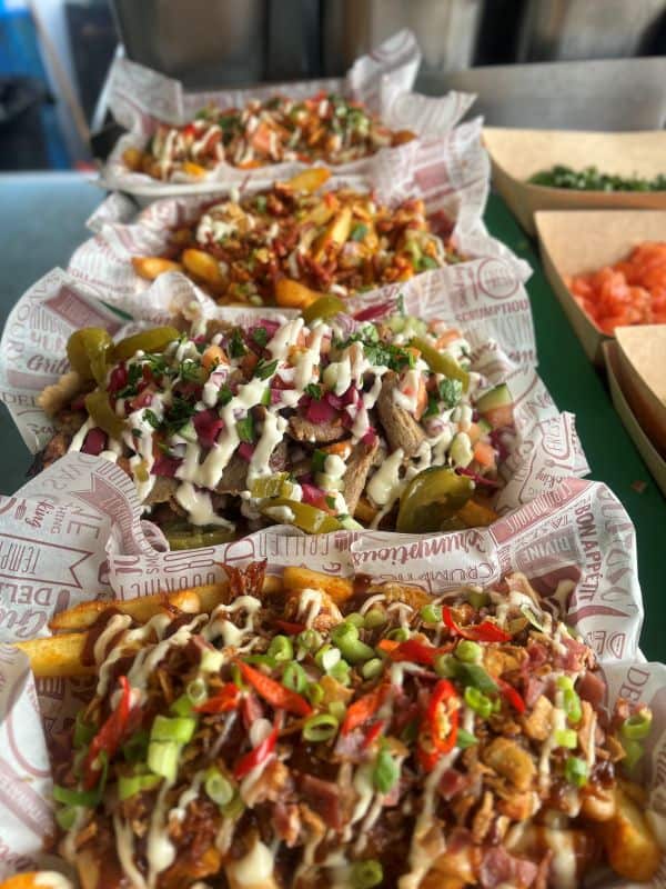 Selection of loaded dirty fries from KK Catering dirty fries van hire
