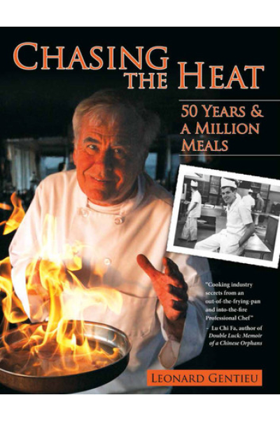Author Leonard Gentieu cooking with flames in a professional kitchen.