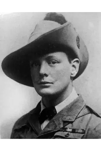 Black and white photo of a young African soldier in uniform and hat.