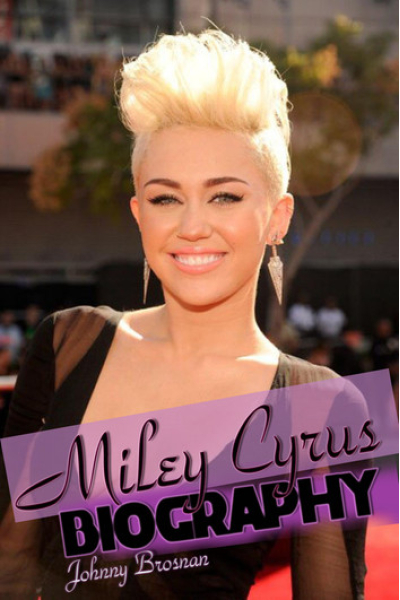 Miley Cyrus with platinum blonde hair smiling at an event.