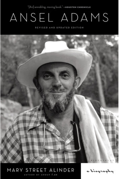Black and white photo of Ansel Adams with hat and beard.