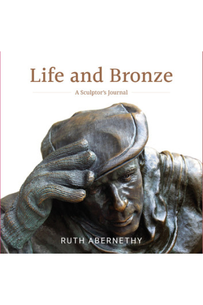 Bronze sculpture of a sculptor's face with hand on forehead, detailed and artistic.
