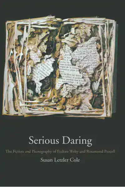 Burned and damaged pages of a book with torn text and charred edges.
