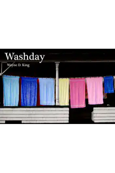Colorful laundry hanging on a line during washday.