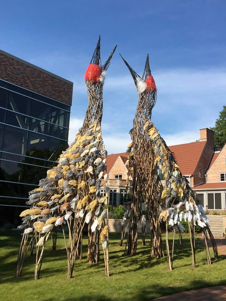 Myth Makers sculpture featuring two large, abstract bird figures by TEMPOart, inspired by local lege.