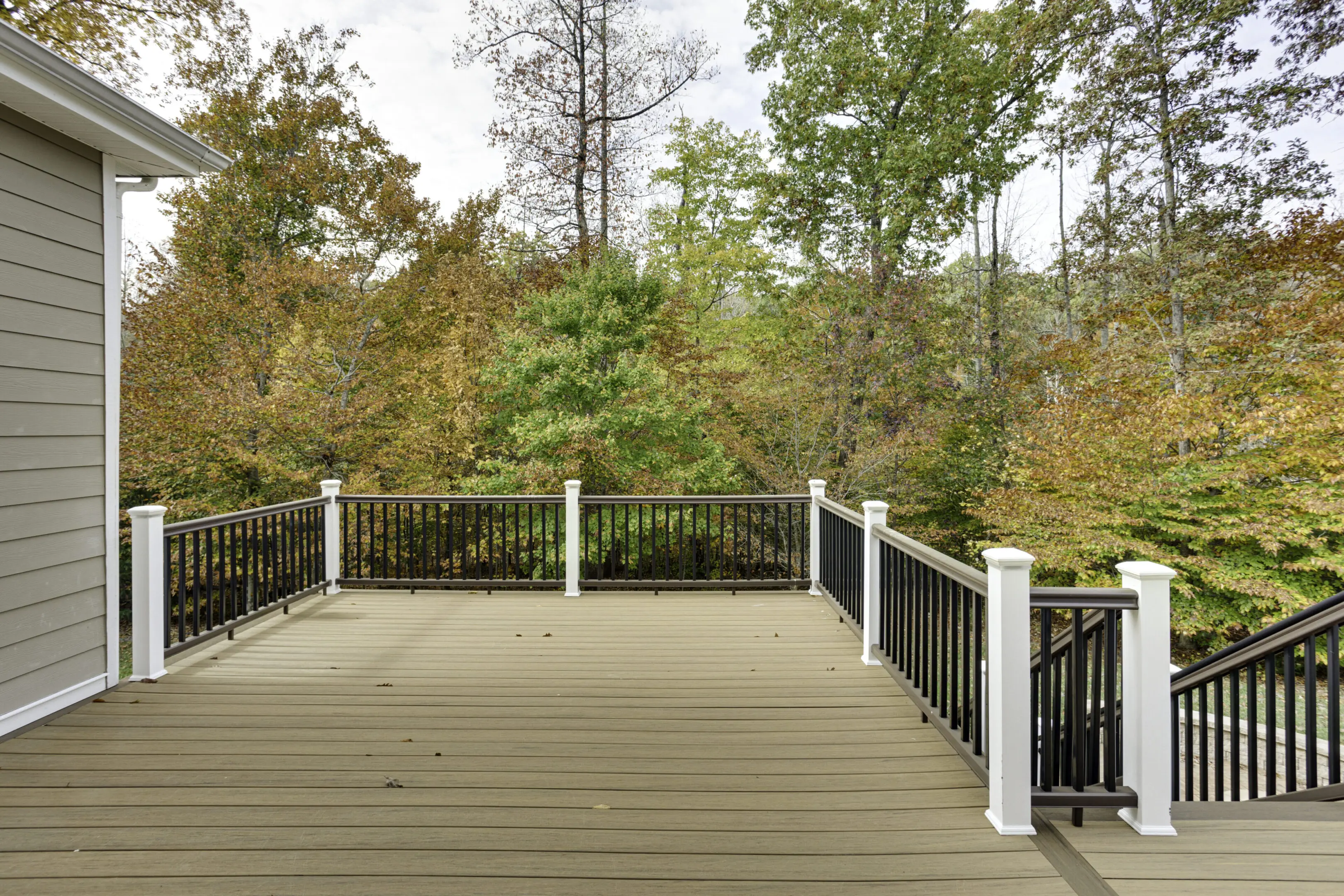 Beautiful outdoor deck with sturdy railing, perfect for relaxing and entertaining. Custom-built for.