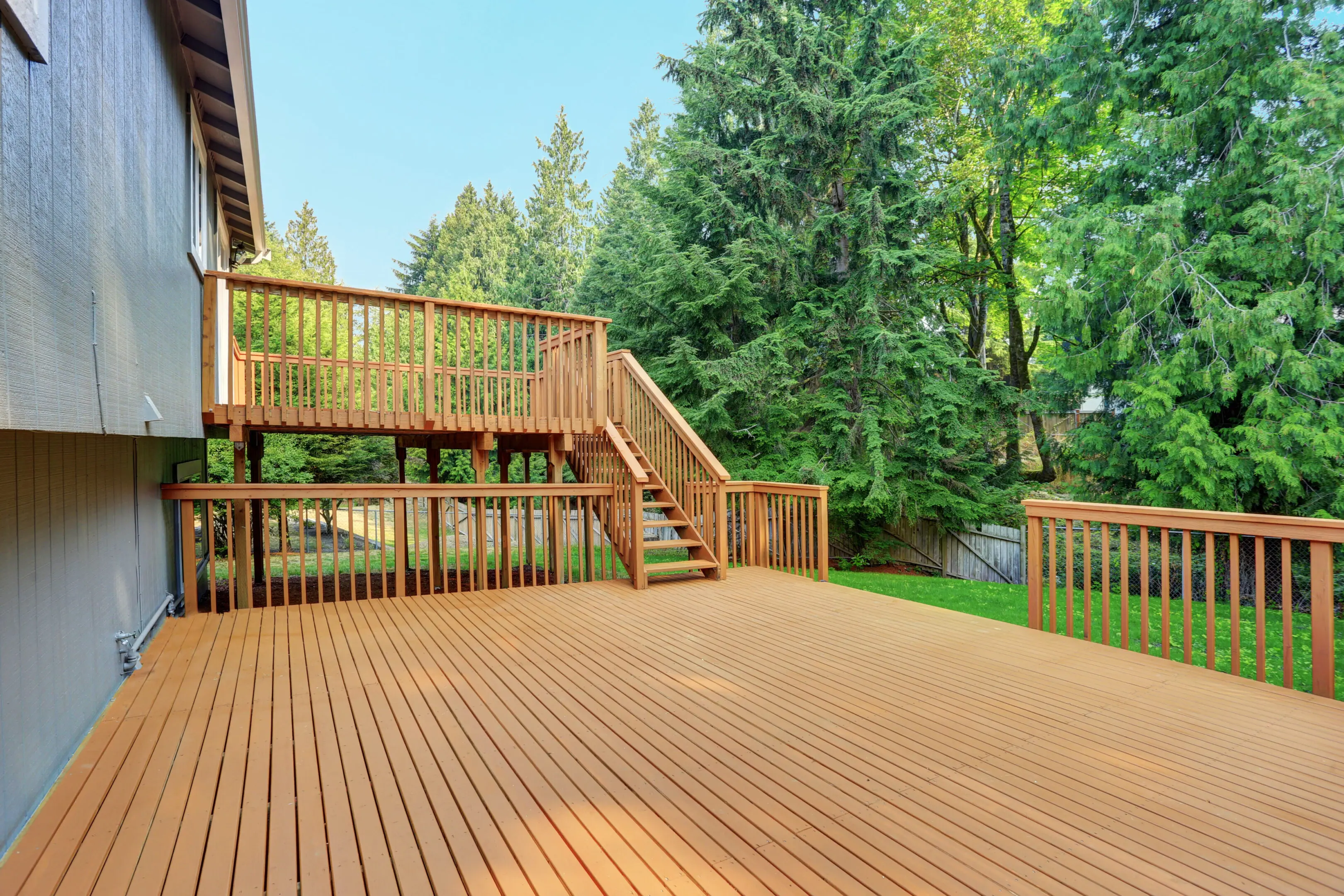 Custom outdoor deck installation by TGR General Construction for enhanced backyard living.