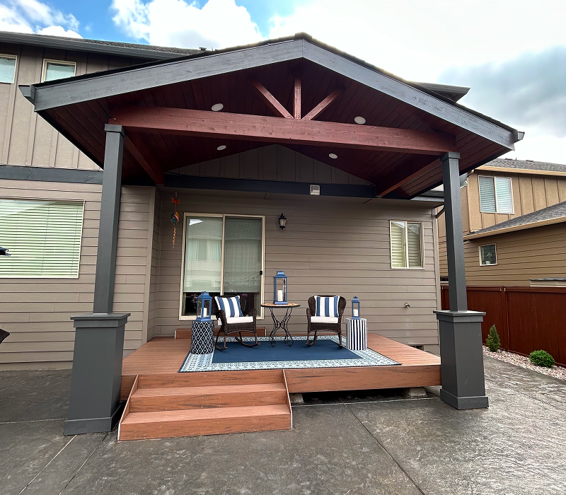 Outdoor covered patio with seating area.