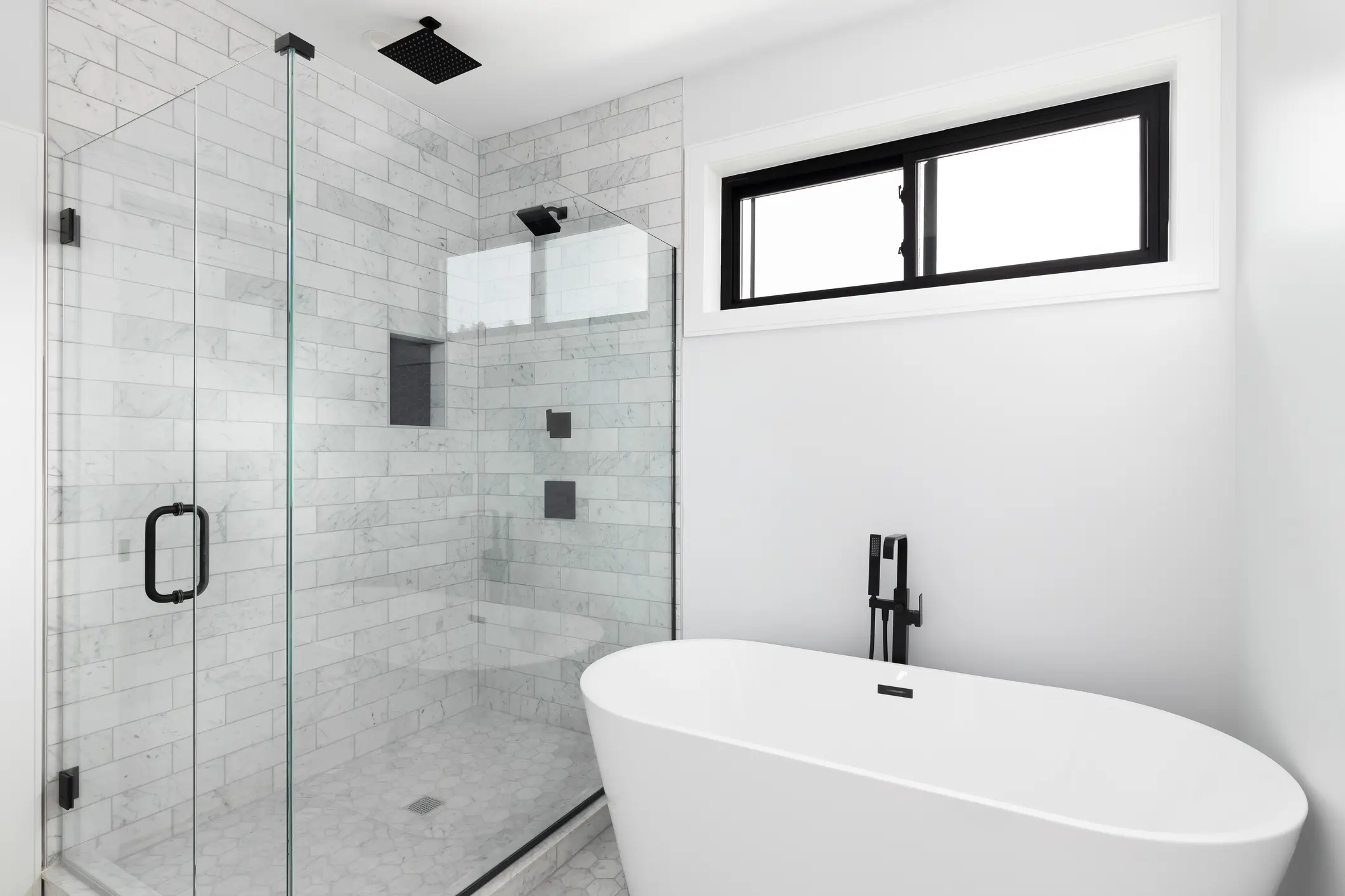 Elegant bathroom with walk-in shower and freestanding tub for a luxurious feel.