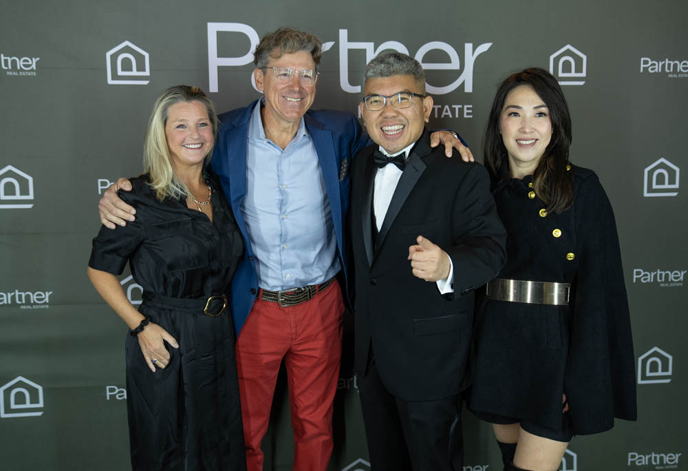 Elegant group photo of The Almaro Team at a Walnut Creek real estate event, showcasing professional camaraderie and celebration.