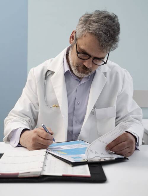 medical billing experts reviewing claims and payer reports