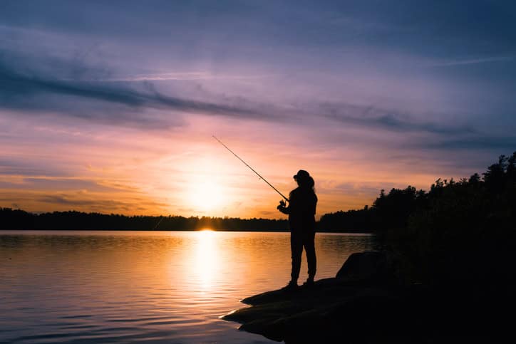 Strategic angler fishing at sunrise representing the focused executive search recruitment process used by The Batten Group