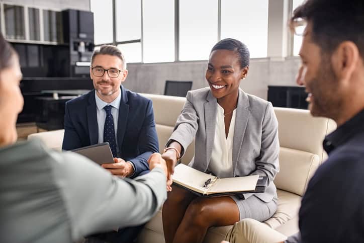 Nonprofit leaders reviewing hiring top talent strategies during an executive search meeting