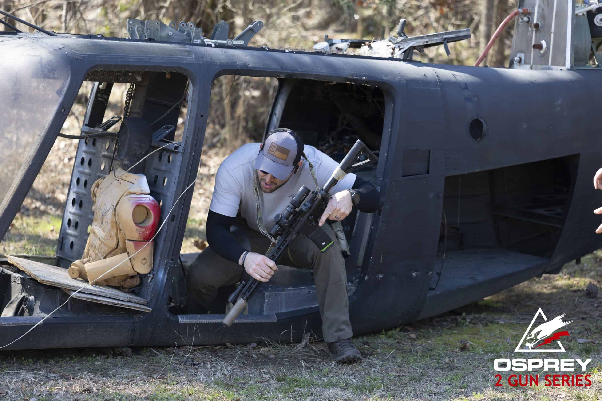Competitor exiting a helicopter with an AR-15 at a 2 Gun competition hosted by Osprey Training Facility