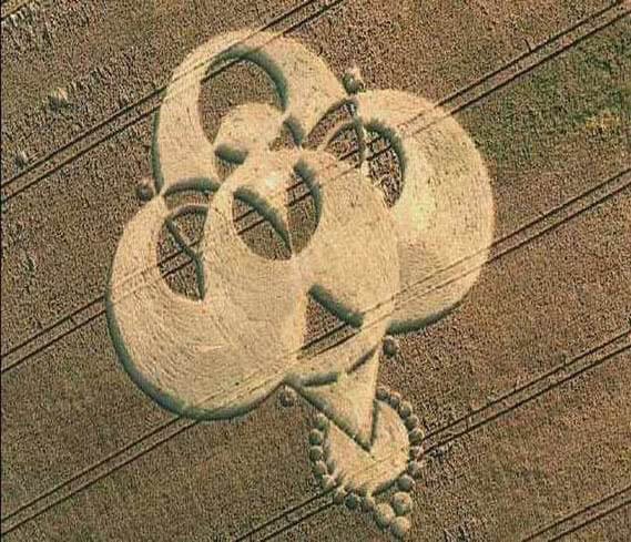 Sacred Heart and cross symbol created in a wheat field, representing faith and spirituality.