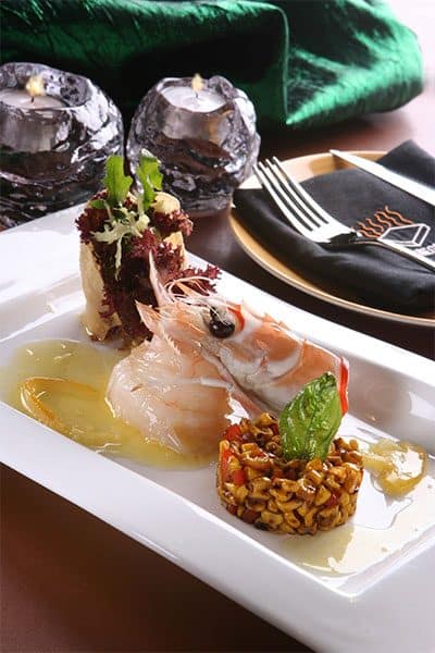 Fresh gourmet seafood dish featuring lobster and garnishes at The Flames Galore Restaurant.